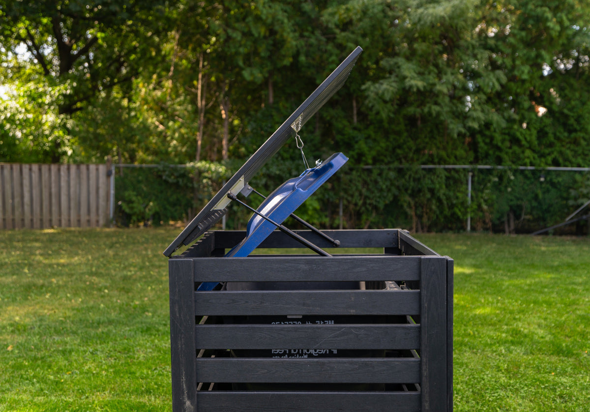 side view of Critter-proof single garbage bin shed built with sustainable composite plastic and a reinforced aluminum frame